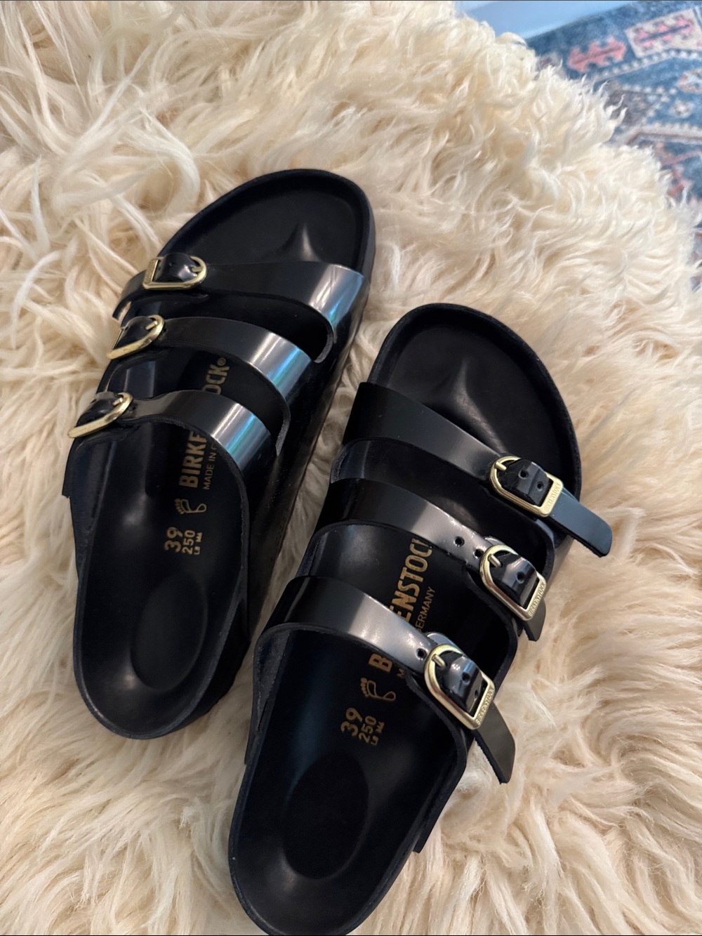 Birkenstock Black Triple-Strap Sandals with Gold Buckles